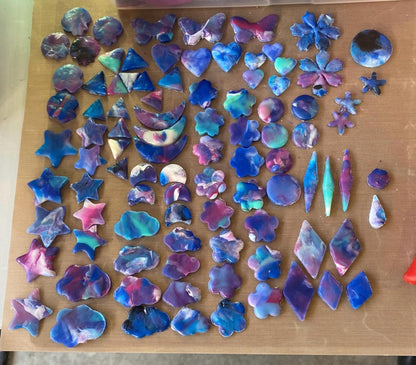 Colorful butterfly-shaped objects on a wooden surface