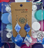 Pair of blue and white earrings on a 'Handmade' card with colorful bottle caps in the background.