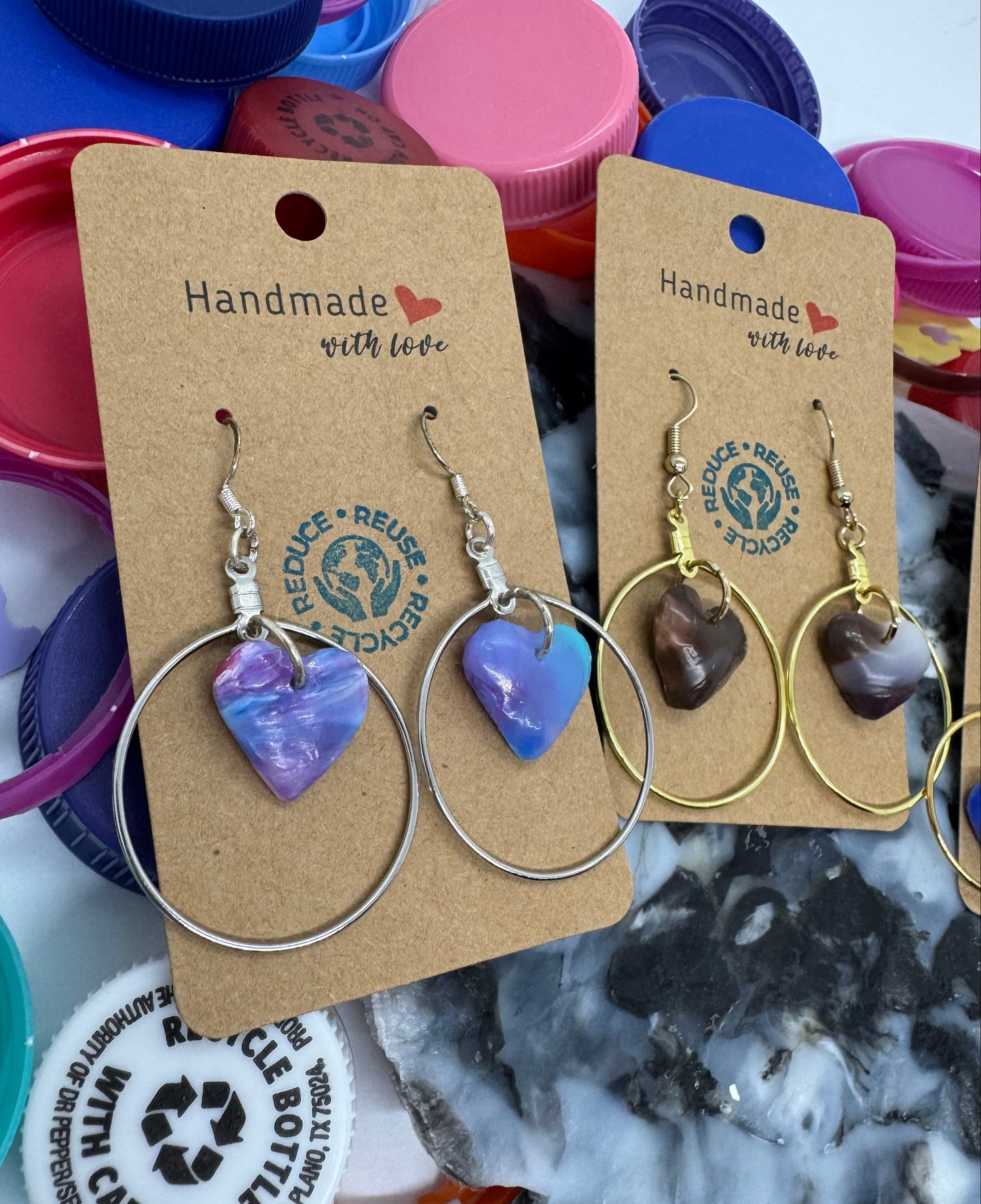 Handmade jewelry with eco-friendly bottle cap background