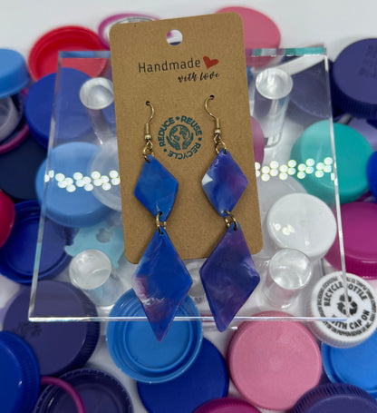 Colorful bottle caps with a clear display case and brand tag on a white background
