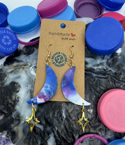 Earring set on a card with colorful bottle caps in the background
